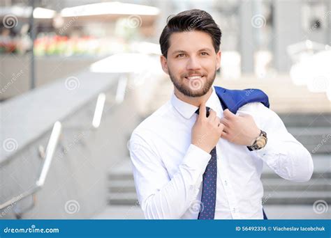 Young Businessman Holding Jacket On Shoulder Stock Photo Image 56492336