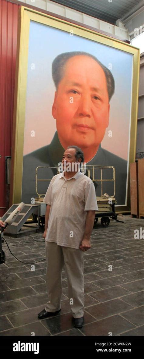 Ge Xiaoguang Stands In Front Of A Giant Portrait Of China S Late