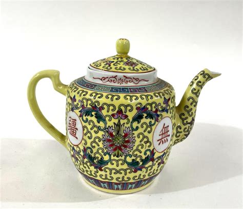 Lot A Vintage Chinese Yellow Mun Shou Teapot With Central Longevity