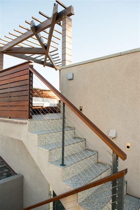 For an outdoor staircase, a free form vine can make a perfect handrail. Cable Railing Sales - San Diego Cable Railings