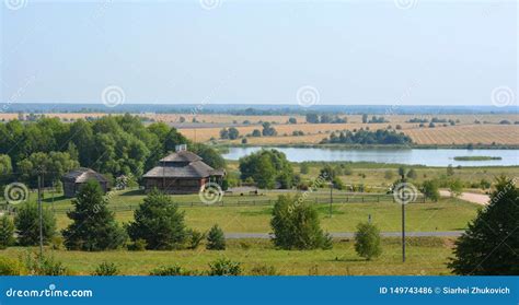 Summer Rural Landscape With Old Cottage And Lake In Belarus Stock Photo