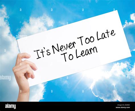 Its Never Too Late To Learn Sign On White Paper Man Hand Holding Paper