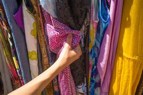 Female Hands Choosing Clothes Market Stall Stock Photos Free