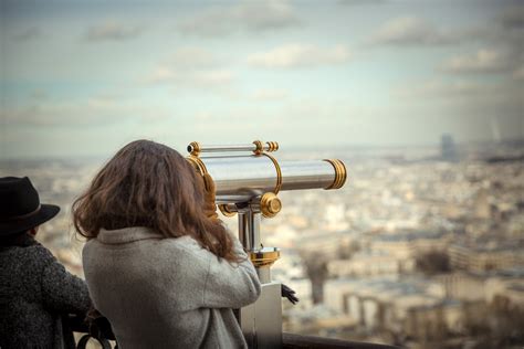 Woman Looking At City Through Telescope Image Free Stock Photo