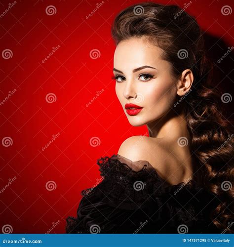 Beautiful Face Of An Young Woman In Black Dress With Red Lipstick Stock