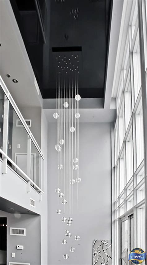 A Gorgeous Extra Long Chandelier And A High Gloss Black Stretch Ceiling