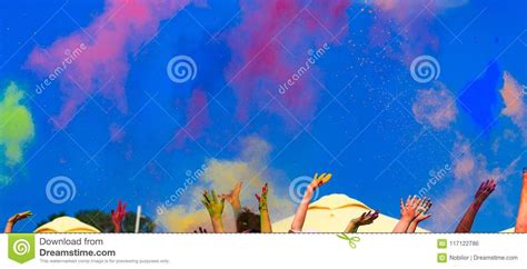 At The Color Holi Festival Hands In The Air Blue Sky Stock Photo