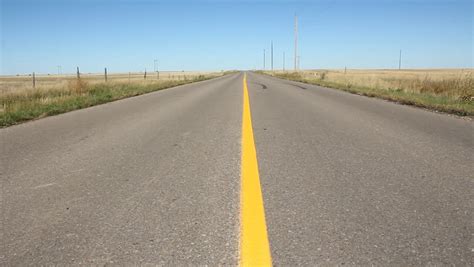 Middle Of The Road Low Angle Center View Of Road With Yellow Line