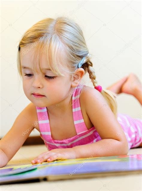 Cute Child Reading ⬇ Stock Photo Image By © Daxiaoproductions 28410157