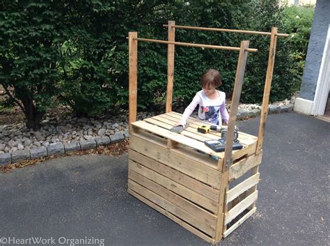 On the first two wood dowels, you're going to cut a slot into one end of each. How to Build a Lemonade Stand from Pallets | HeartWork ...