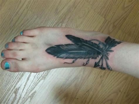 Women Arrow Tattoo And Feathers On Foot Tattooimages Biz
