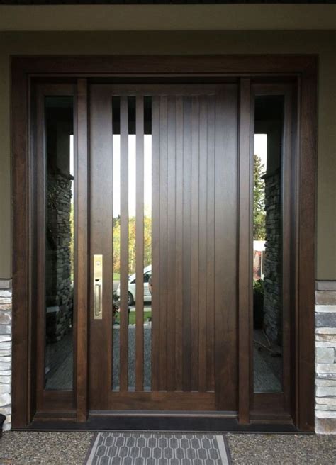 A Modern Wooden Door With Glass Panels And Sidelights On The Front Of A