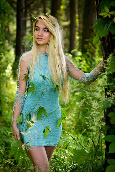 Pretty Young Blonde Girl With Long Hair In Turquoise Dress