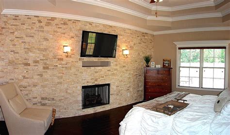 A Stone Accent Wall Brings Interest To This Master Bedroom The Drayton