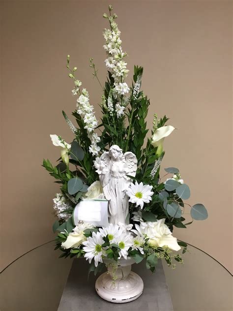 Capability means being able to fill the order to value at the appropriate price point and ensure timely delivery. All white angel arrangement. #shoplocal #indyflorist # ...