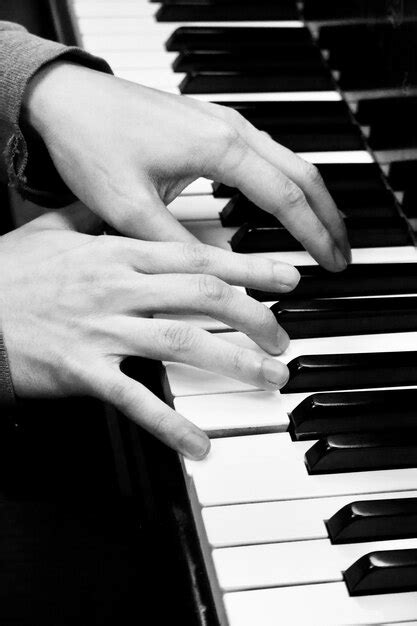 Premium Photo Cropped Hands Of Person Playing Piano