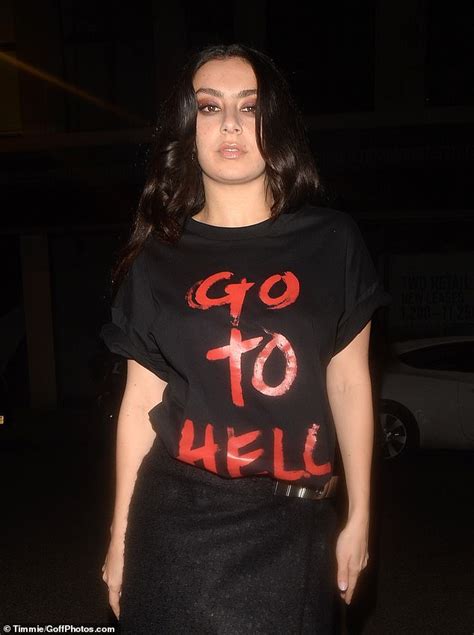 Charli Xcx Flaunts Her Toned Midriff In A Black Crop Top And Miniskirt