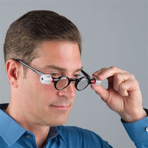 The Only Adjustable Focus Reading Glasses Hammacher Schlemmer
