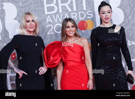 tina barrett rachel stevens and jo o meara pose for photographers upon arrival at the brit