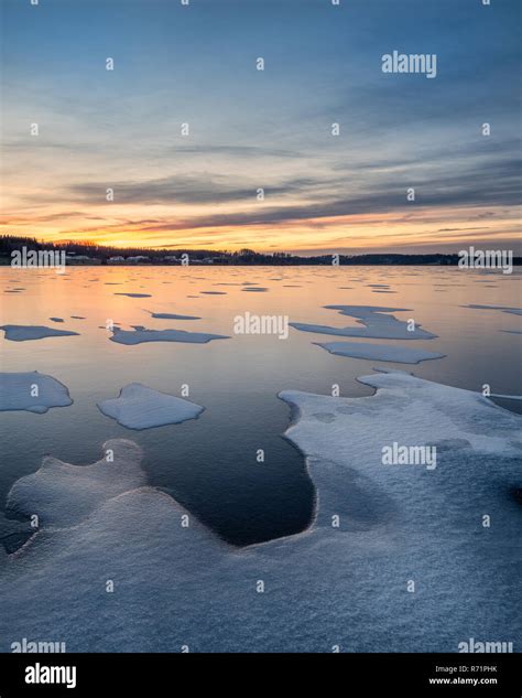 Scenic Winter Landscape With Frozen Lake Sunset And Beautiful Evening