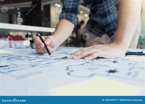Architect Reviewing And Showing Blueprint Architecture Sketch Royalty
