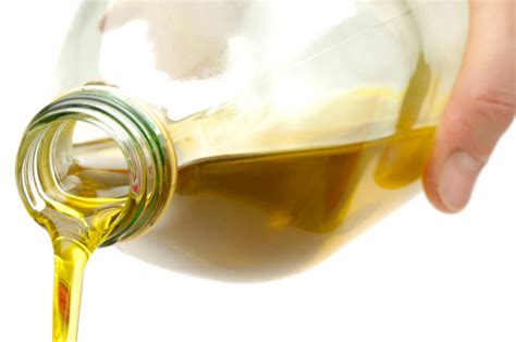 Pouring Olive Oil From A Bottle Stock Photo Download Image Now Istock