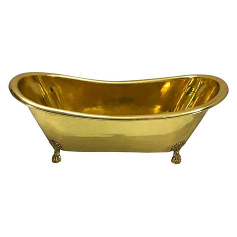 It attaches to one side, and has a smaller surface. Clawfoot Brass Bathtub - Coppersmith® Creations