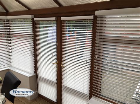 White Faux Wood Blinds In A Golden Oak Conservatory