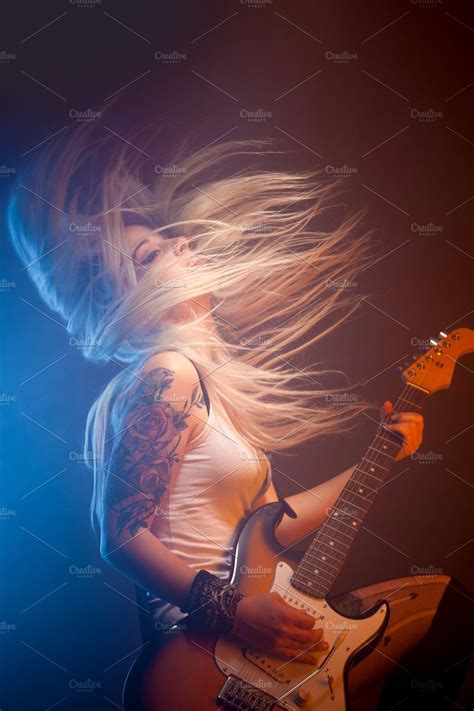Woman Playing Electric Guitar Stock Photo Containing Concert And