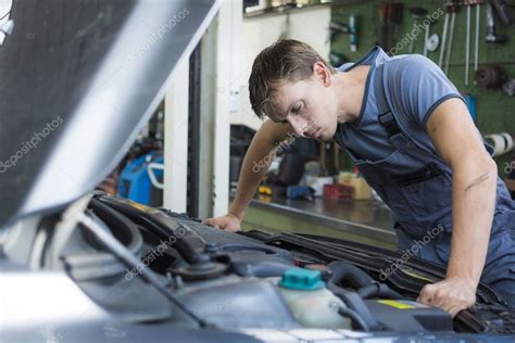Calculating this checksum can be difficult. Mechanic checking car — Stock Photo © Mactrunk #51827479