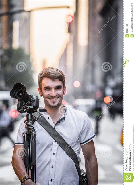 Profesionnal Photographer Standing In The Street Of New York During