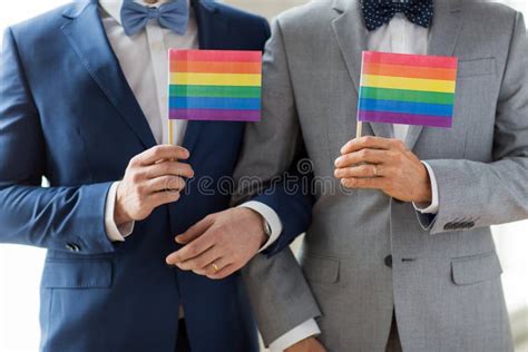 close up of male gay couple holding rainbow flags stock image image of hands person 52411169