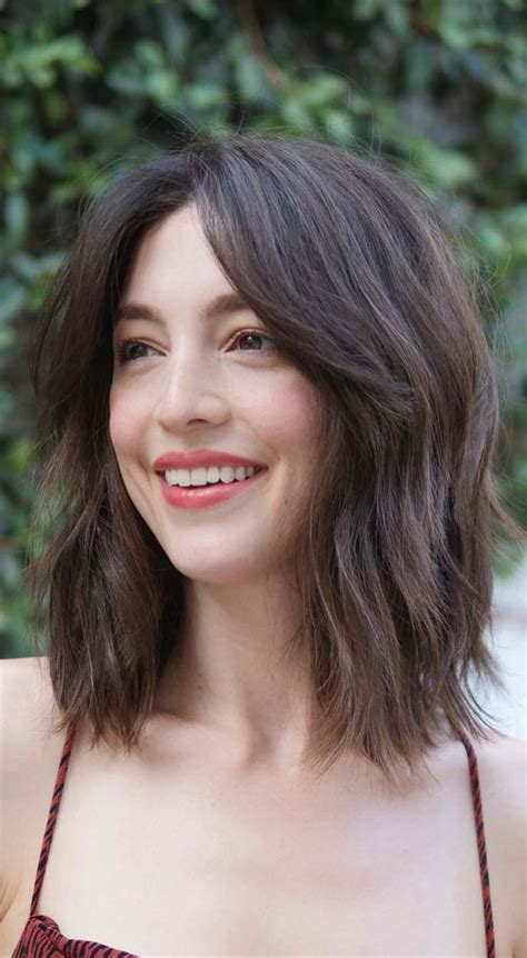 For inspiration on cool haircuts and styles, check out these trendy curtain haircut styles to get on your next visit to the barber. 22 Best Curtain Bangs For Every Hair Type : Lob haircut with bang
