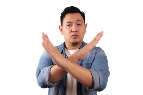 Premium Photo Young Asian Man Shows Crossed Arms Gesture Giving Warn