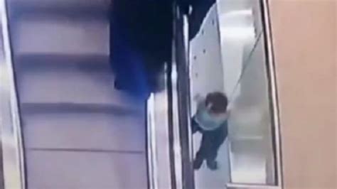 Moment Girl Plunges Down Two Floors After Falling From Escalator As