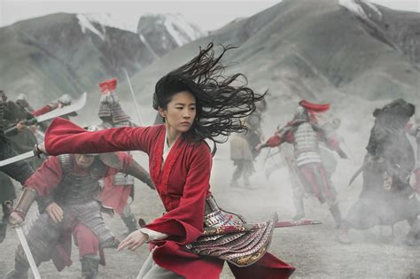 mulan review disney s remake puts the action into live action the gate