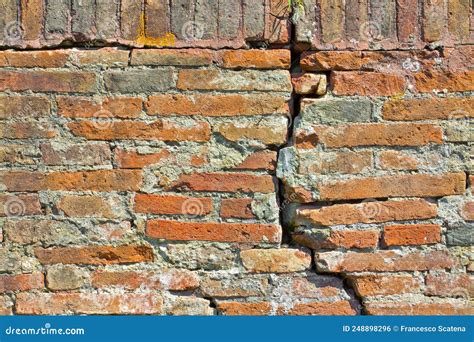 Old Brick Wall Cracked And Damaged Due To Structural Failure