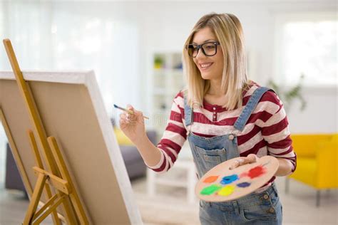 Female Artist Painting On A Canvas Stock Image Image Of Looking