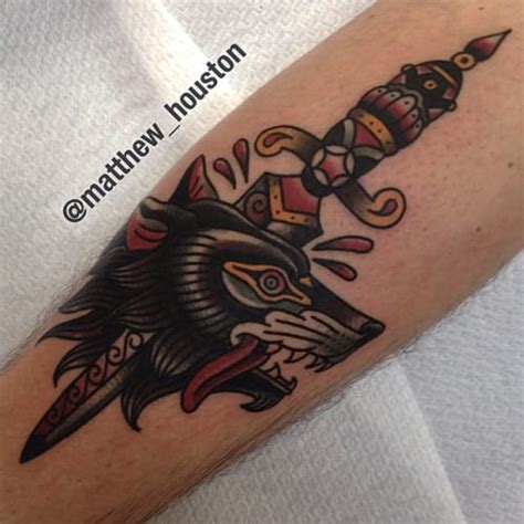 18 Dynamic Wolf Dagger Tattoos Tattoodo