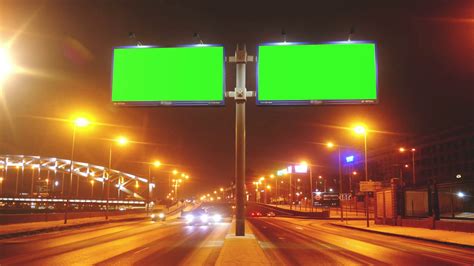 a Billboard With a Green Screen on a Streets Stock Video Footage - Storyblocks