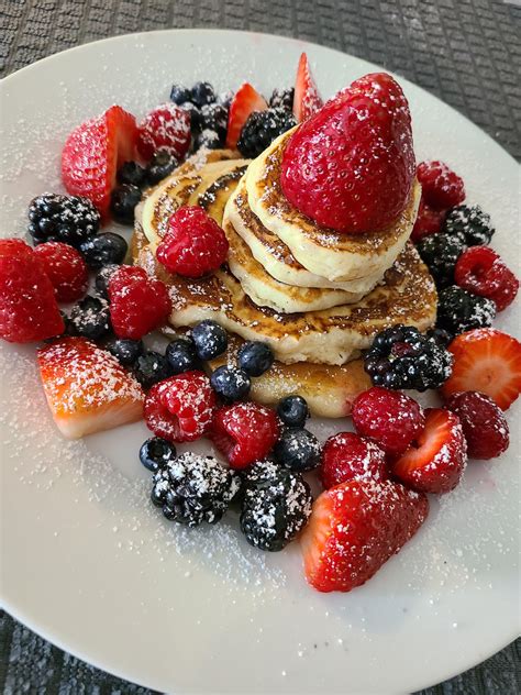 Homemade Pancakes With Fresh Berries Syrup And Icing Sugar Food
