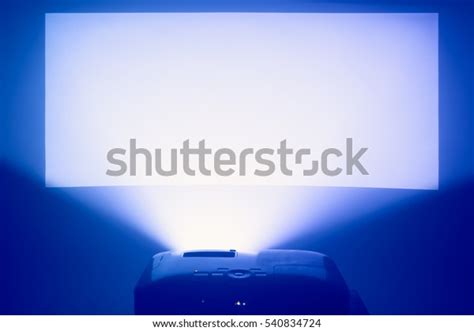 Projector Action Illuminated Warm Blue Screen Stock Photo Edit Now