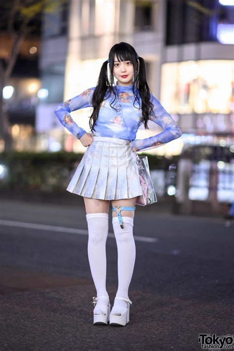 her look here features a japanese twintails hairstyle with a long sleeve print top from the