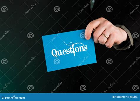 Businessman Holding Blue Card With Text Questions Stock Image Image