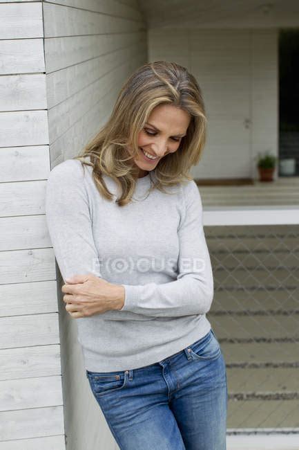 Mature Woman With Arms Folded Smiling White Color Wearing Stock Photo