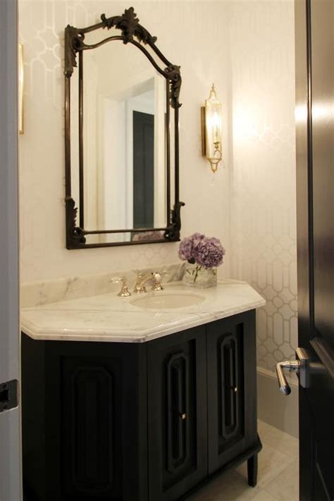 Black And Gold Powder Room With Gold Oval Sunburst Mirror