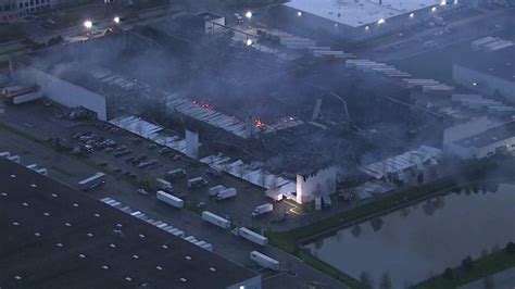 Roomplace Warehouse Fire Still Burning In Woodridge Abc 7 Chicago