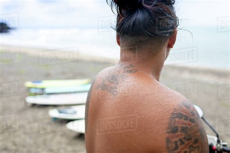Man Looking At Surfboards On Beach Pagudpud Ilocos Norte Philippines