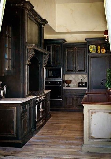 The rich black stain on these cabinets emphasizes the clean lines, sleek hardware, and beautiful wood grain. Black Kitchen Cabinets with Some White Accents - Traba Homes