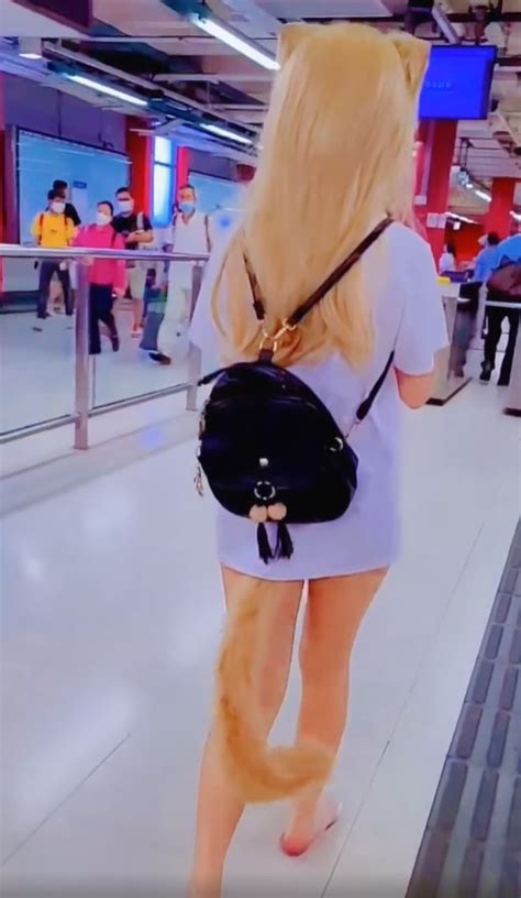 woman wearing fox tail anal plug sex toy spotted in mtr station dimsum daily
